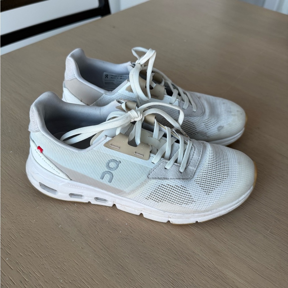 On Cloud Running Cream and White Athletic Shoes
